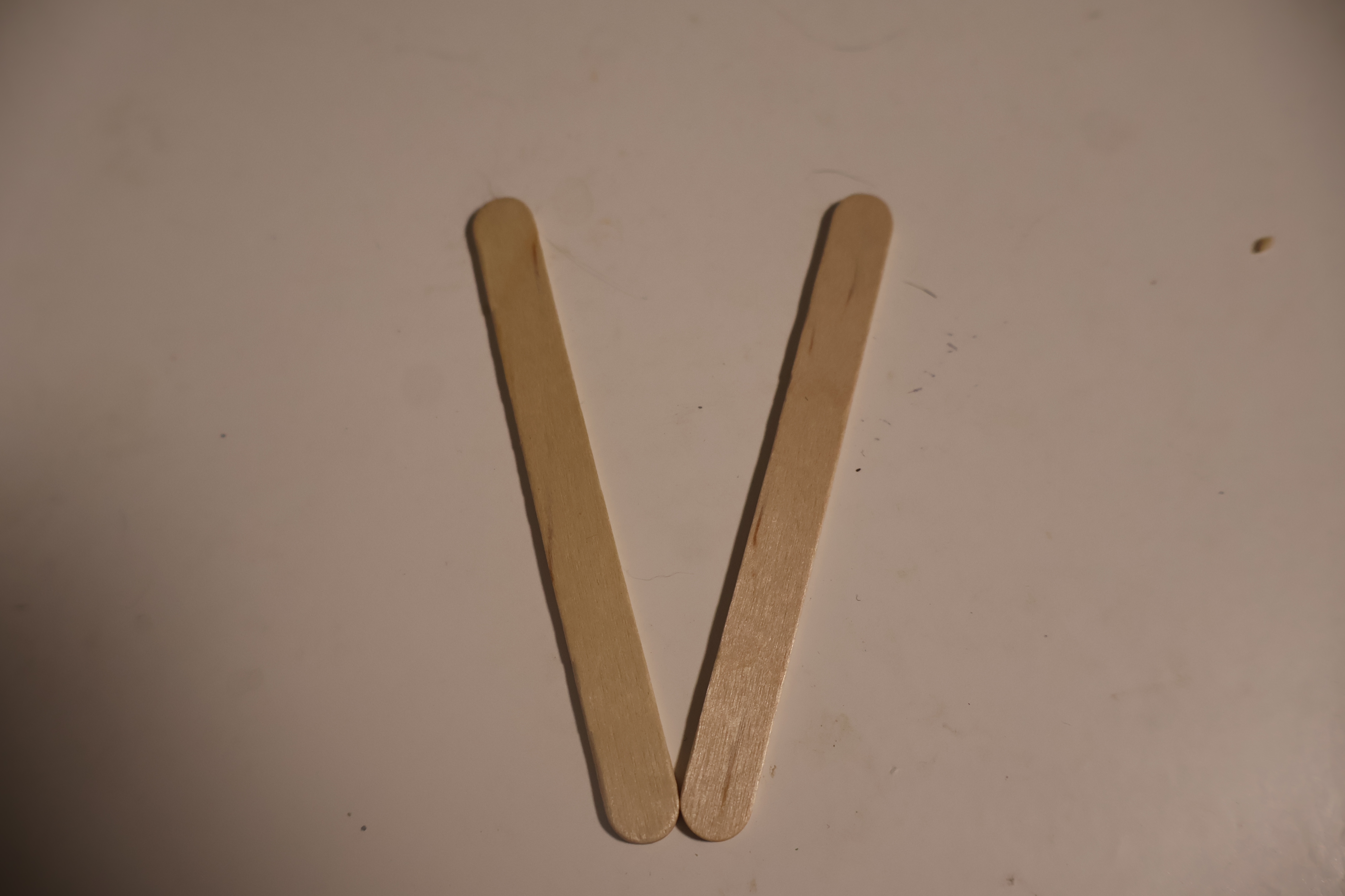 Step 1: Make a V shape with the two paddle pop stick